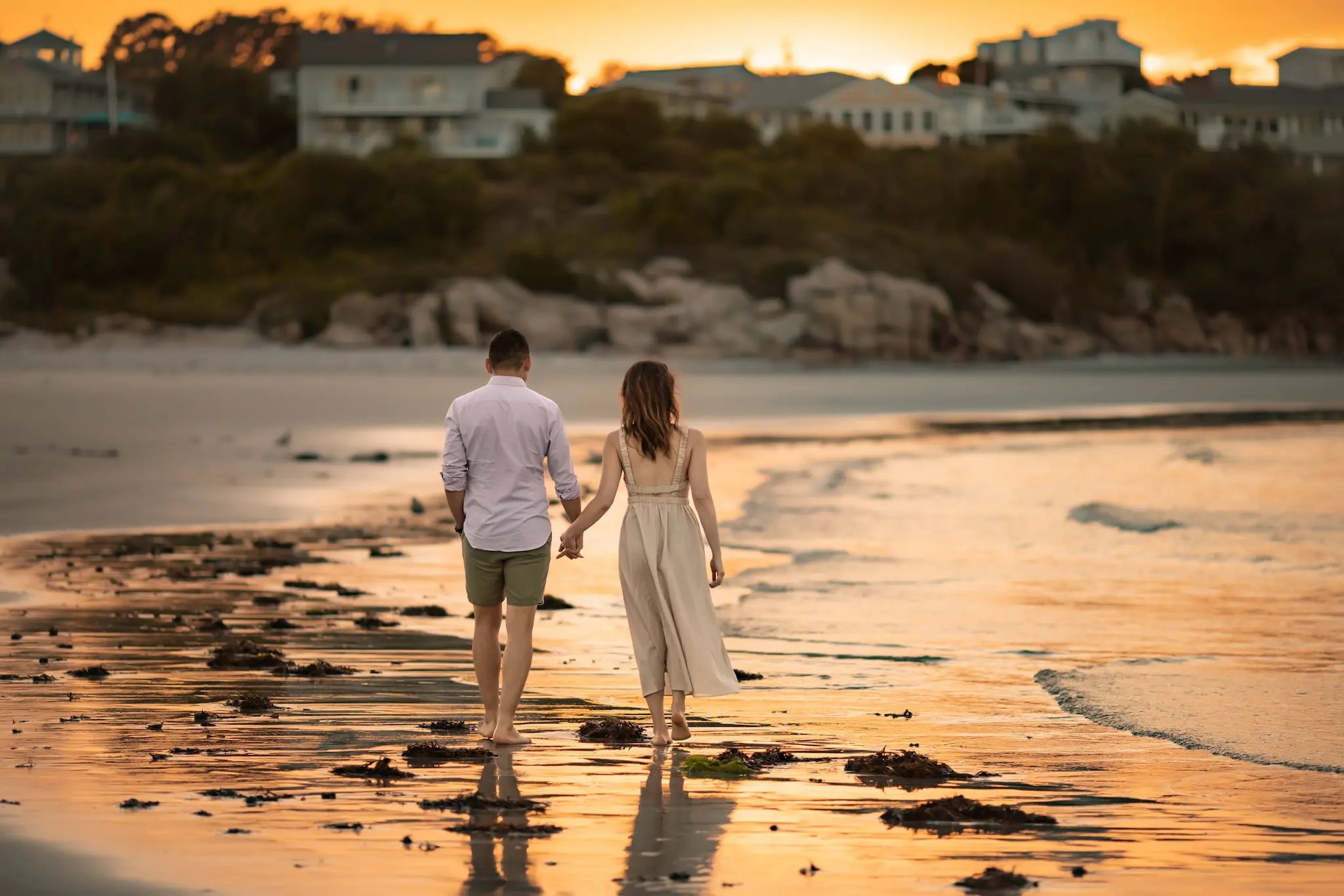 beach-portrait-couple-sunset-holding-hands